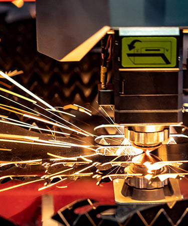 A Bystronic laser cutting steel with sparks flying