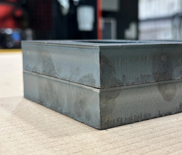 Thick mild steel with no burr which was laser cut.