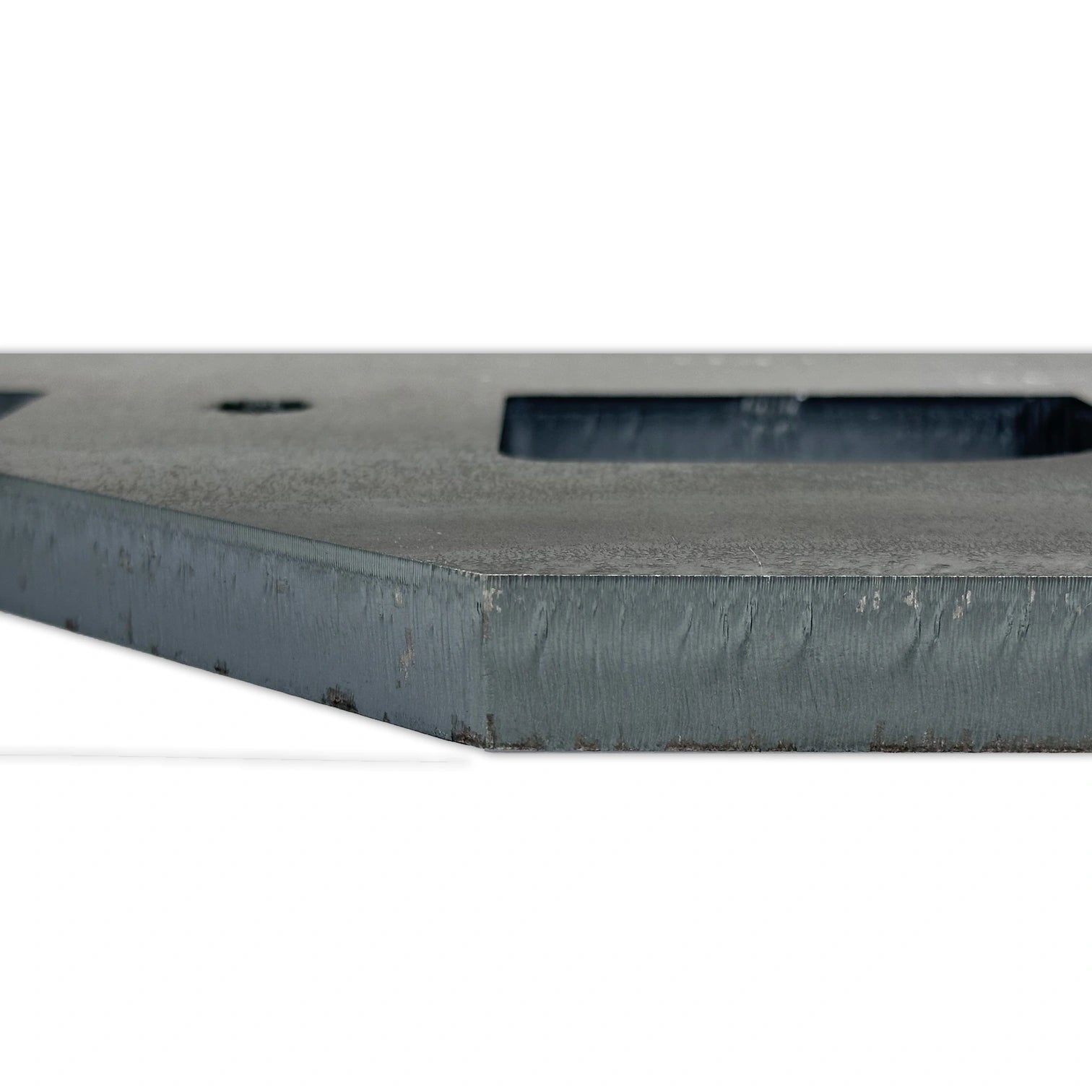 30mm Mild steel that has been cut using only nitrogen, showing burr