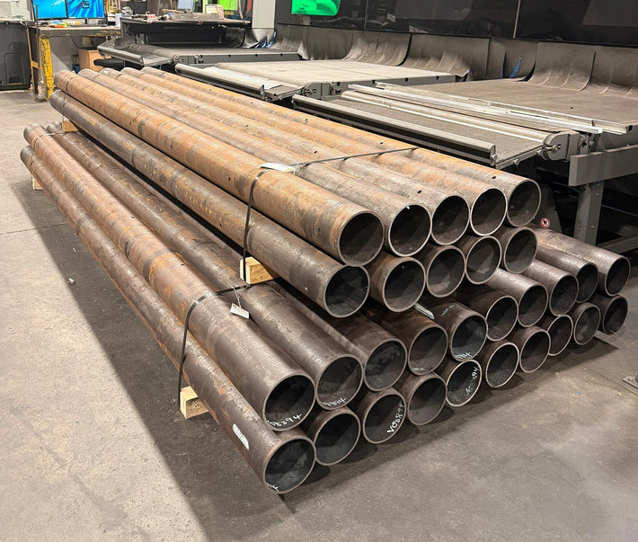 Stack of mild steel tube which was laser cut in an industrial setting.