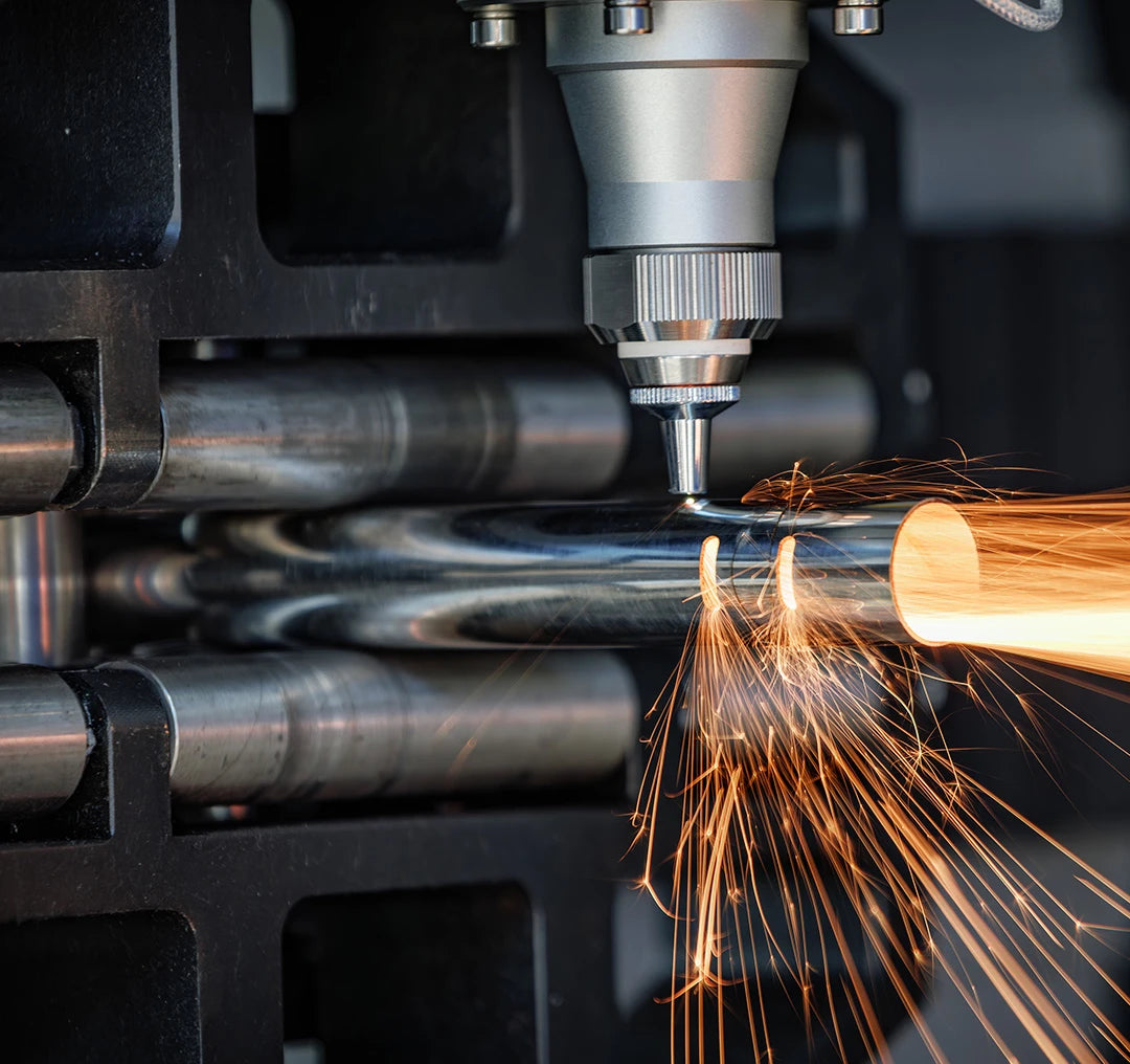Tube Metal cutting process with sparks in a workshop setting
