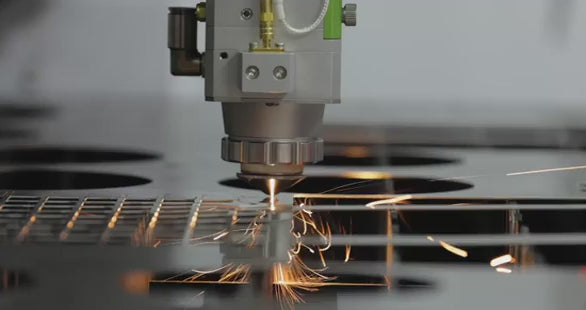 High-precision fiber laser cutting machine processing flat sheet metal for industrial manufacturing applications